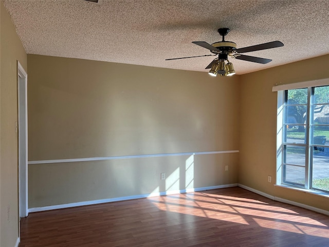 unfurnished room featuring wood-type flooring, a textured ceiling, and ceiling fan