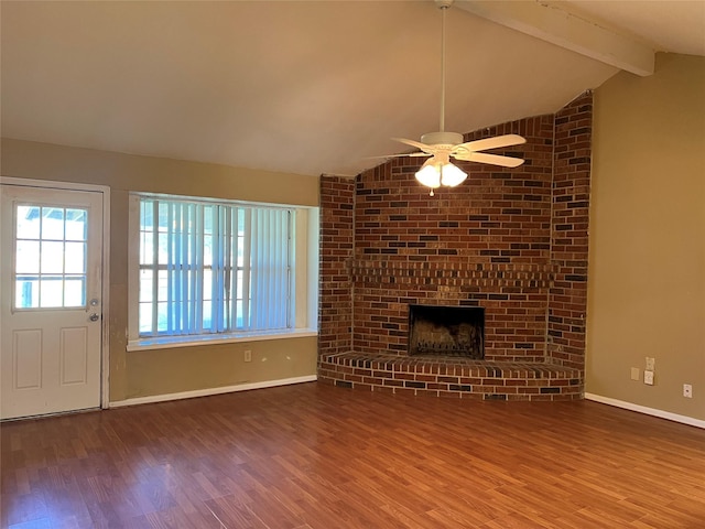 unfurnished living room with hardwood / wood-style floors, vaulted ceiling with beams, ceiling fan, and a fireplace