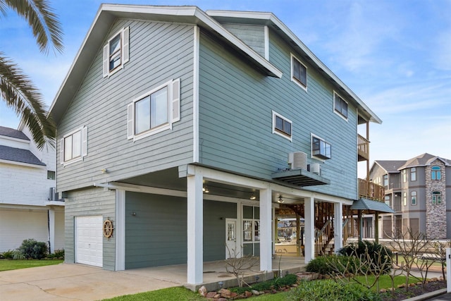 exterior space with a garage and a balcony