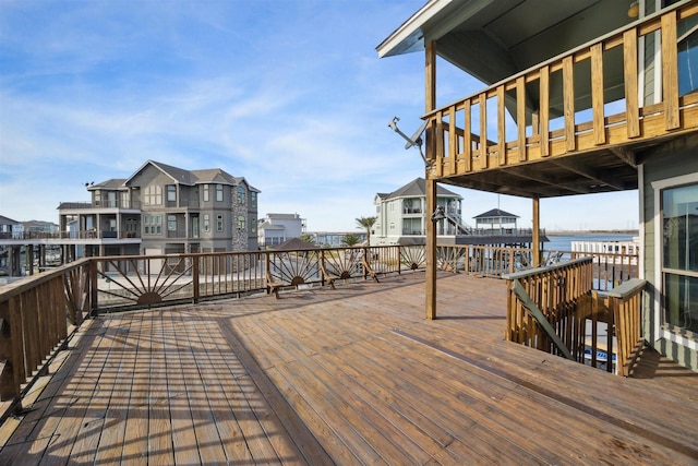 wooden deck featuring a water view