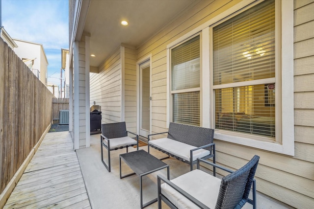 wooden deck with central AC unit