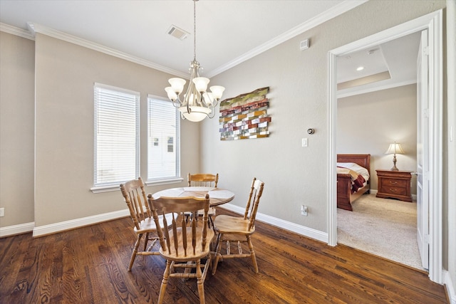 dining area with dark hardwood / wood-style flooring, an inviting chandelier, and crown molding