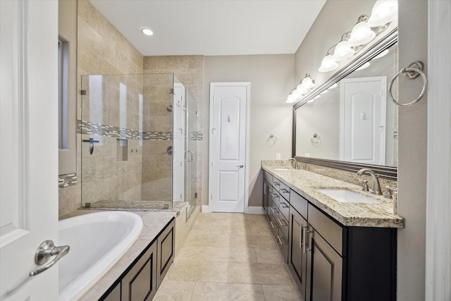 bathroom with plus walk in shower, vanity, and tile patterned flooring