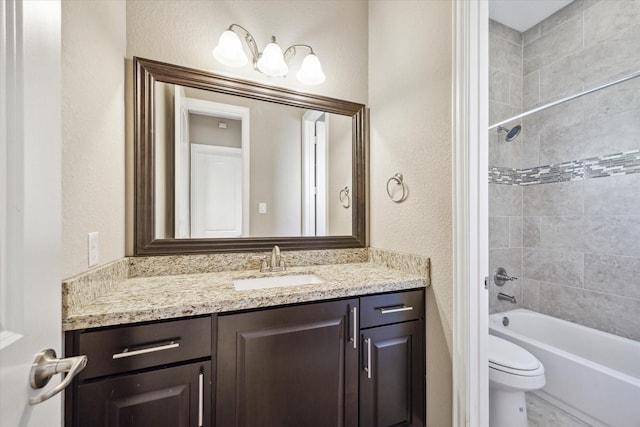 full bathroom with vanity, toilet, and tiled shower / bath