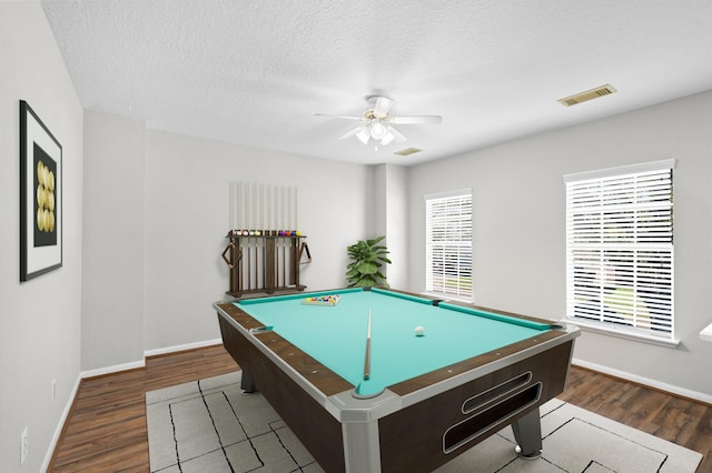 playroom featuring pool table, dark hardwood / wood-style flooring, a textured ceiling, and ceiling fan