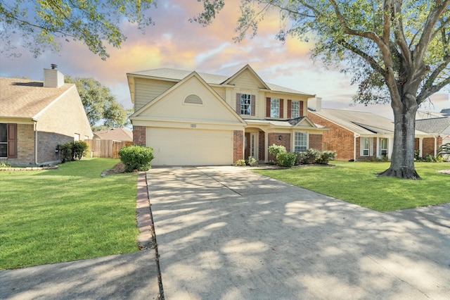 view of front facade with a lawn and a garage