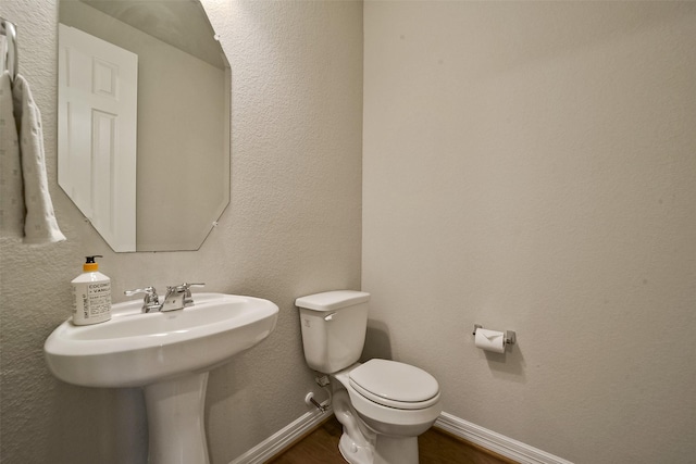 bathroom featuring toilet