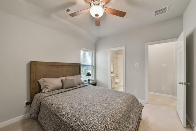 carpeted bedroom with ensuite bath, ceiling fan, and lofted ceiling