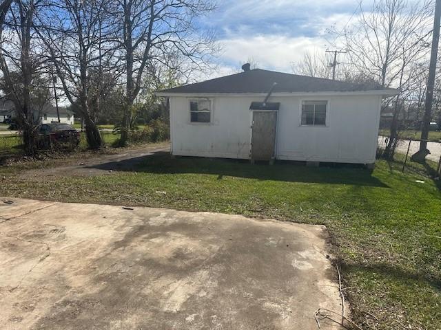 view of outdoor structure with a lawn