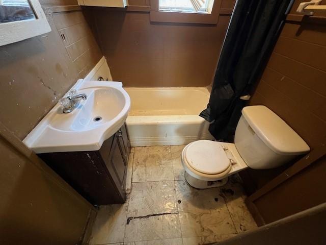 full bathroom with vanity, toilet, and shower / bath combo with shower curtain