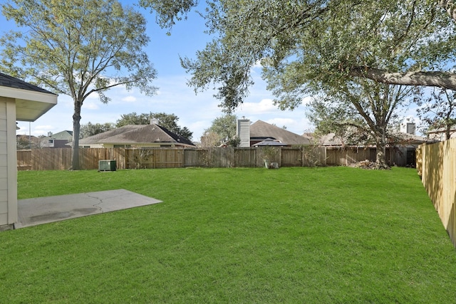 view of yard with a patio area and central AC unit