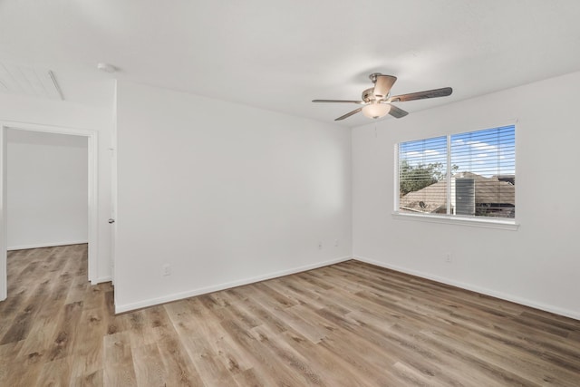 spare room featuring ceiling fan and light wood-type flooring