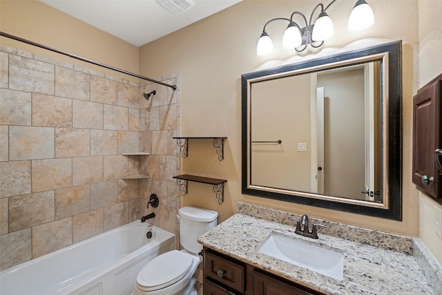 bathroom with a textured wall, toilet, visible vents, vanity, and tub / shower combination