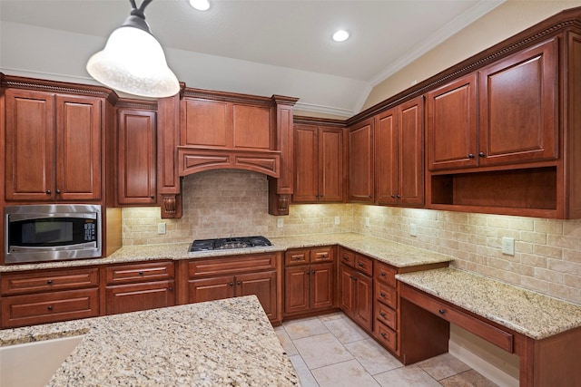 kitchen featuring stainless steel appliances, recessed lighting, backsplash, vaulted ceiling, and light stone countertops