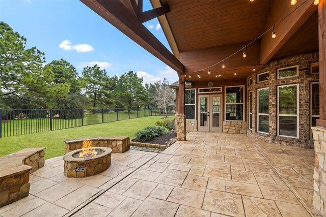 view of patio / terrace featuring french doors and an outdoor fire pit