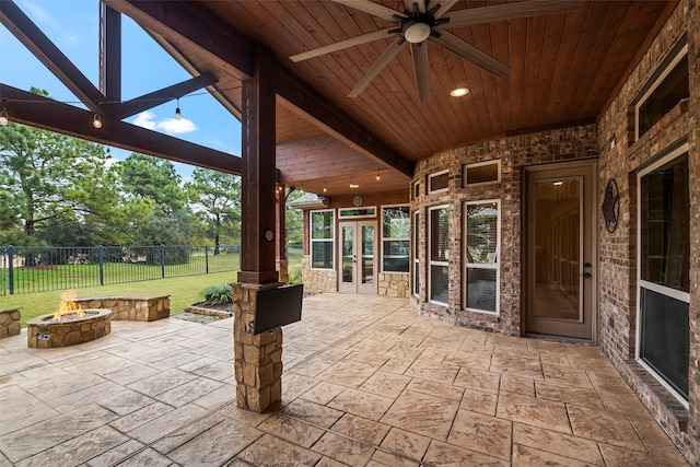 view of patio / terrace featuring french doors, ceiling fan, and an outdoor fire pit