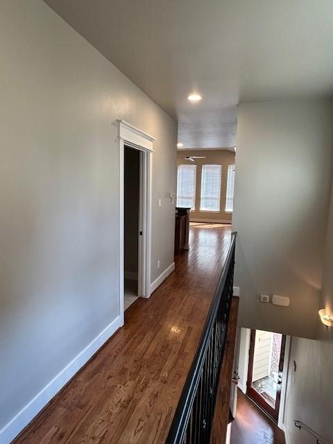 hall with dark hardwood / wood-style floors