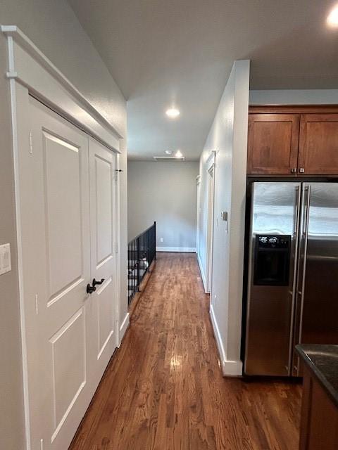 hallway with dark hardwood / wood-style floors