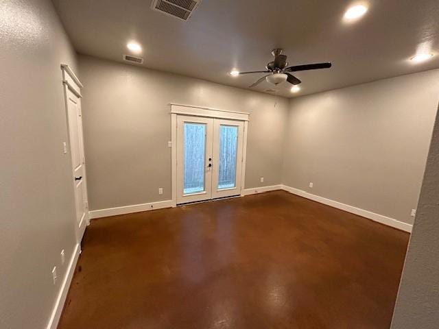 spare room with ceiling fan and french doors