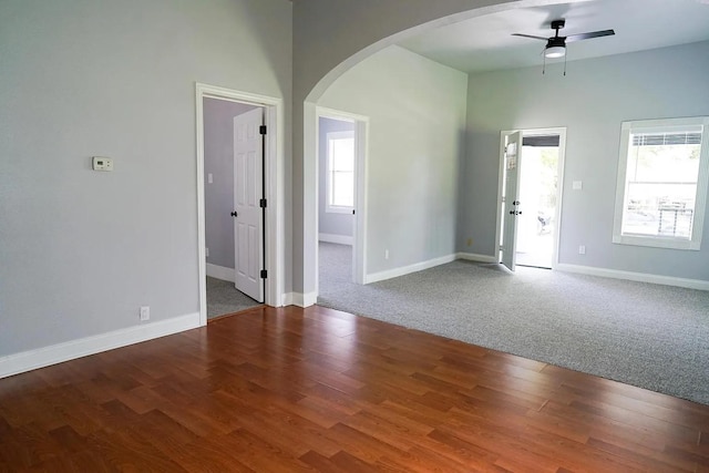 spare room featuring hardwood / wood-style flooring and ceiling fan