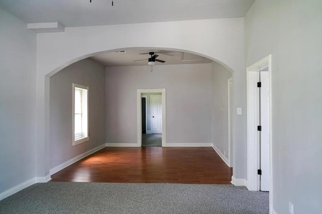 carpeted empty room featuring ceiling fan