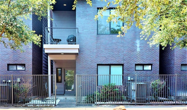 view of front of house with a balcony