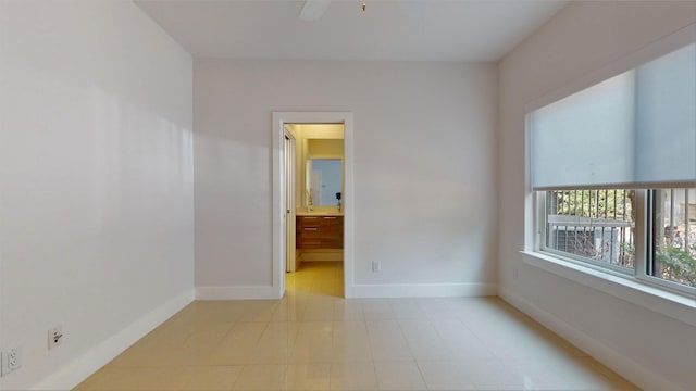 unfurnished room featuring ceiling fan