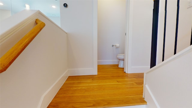 hall with light hardwood / wood-style flooring