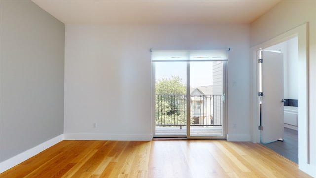 empty room with hardwood / wood-style floors