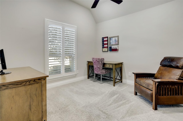 carpeted office space with vaulted ceiling and ceiling fan