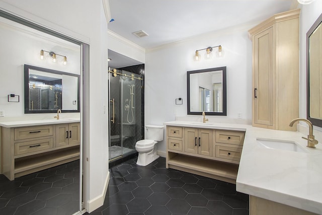 bathroom featuring an enclosed shower, tile patterned flooring, toilet, and vanity