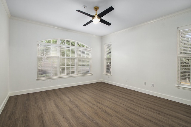 spare room featuring dark hardwood / wood-style floors, ceiling fan, and ornamental molding