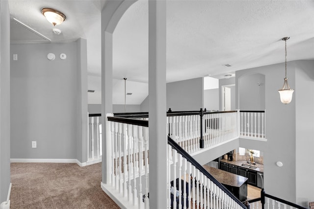 hallway featuring light carpet