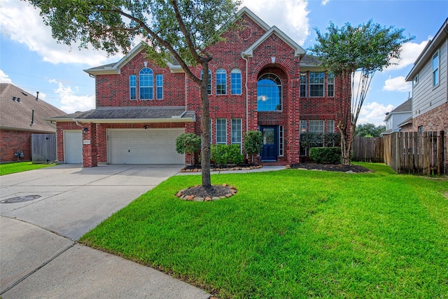 view of front of home with a front yard and a garage