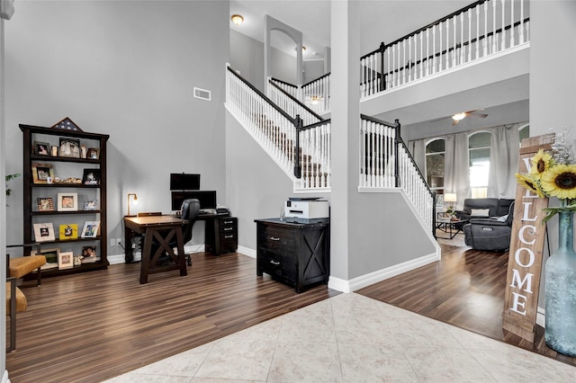 tiled foyer with french doors and a high ceiling