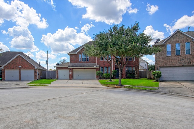 view of front property with a front lawn and a garage