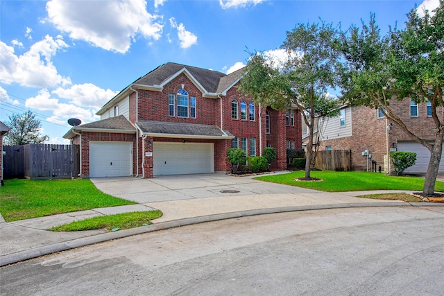 view of front of property with a garage and a front lawn