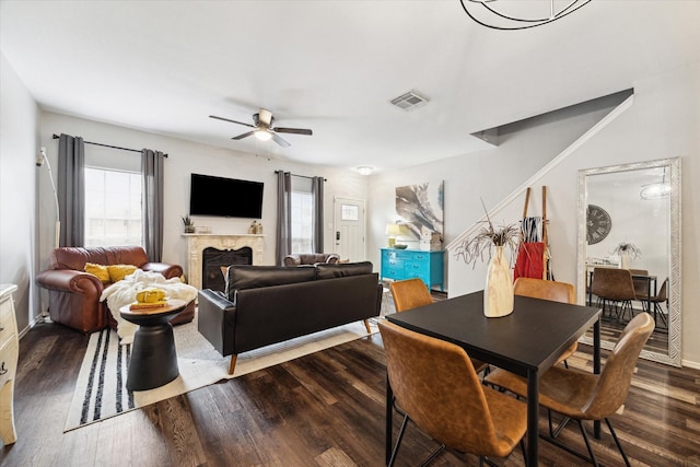 dining area featuring hardwood / wood-style flooring and ceiling fan