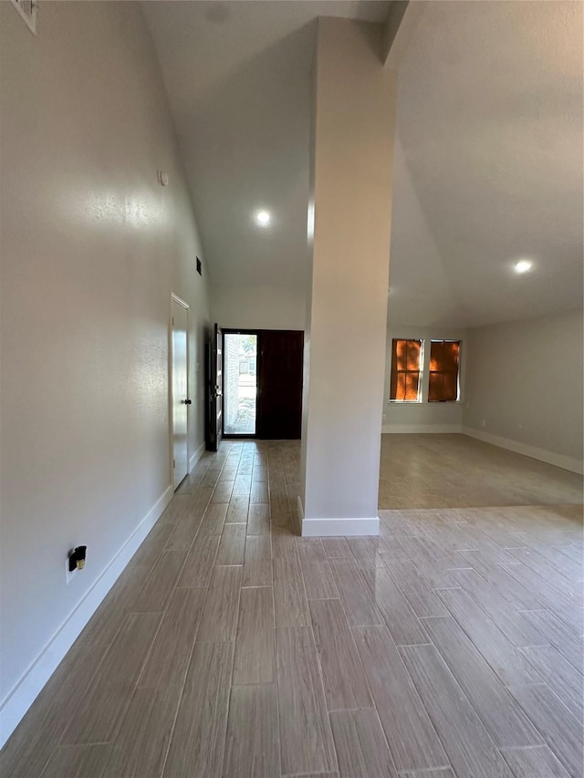 spare room with a towering ceiling