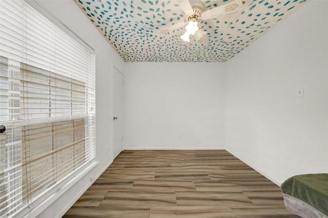 unfurnished room with hardwood / wood-style flooring