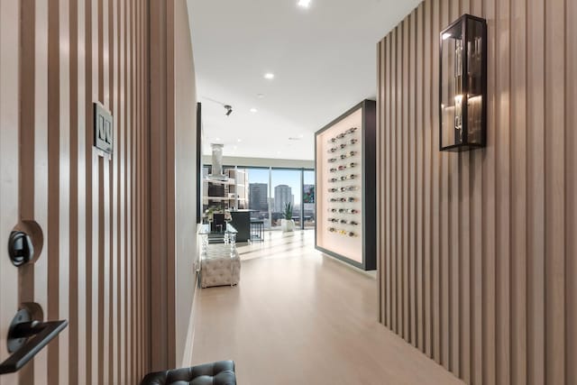 hallway with light hardwood / wood-style flooring