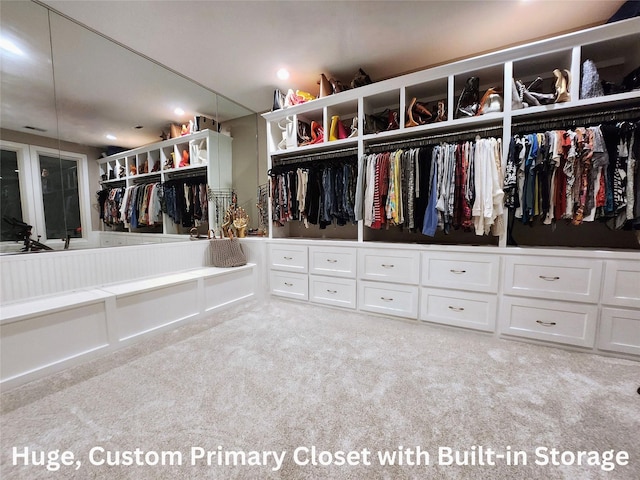 walk in closet featuring carpet