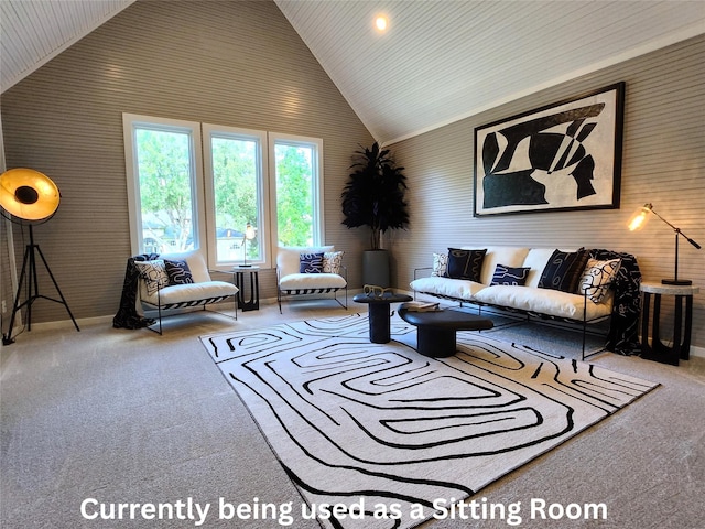 living room featuring high vaulted ceiling and carpet floors