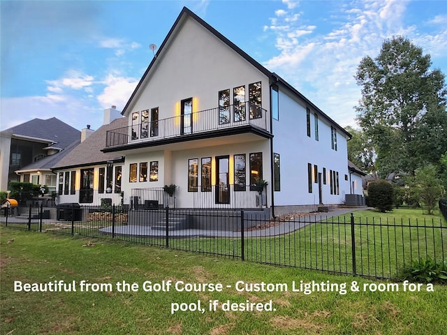 back of house with a lawn, central air condition unit, and a balcony