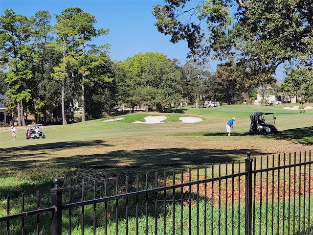 view of home's community with a lawn