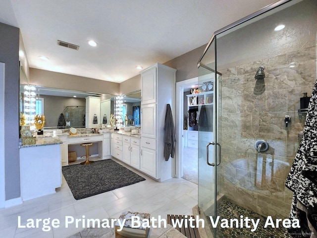 bathroom featuring an enclosed shower and vanity