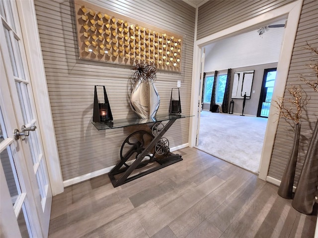 corridor featuring french doors and hardwood / wood-style flooring