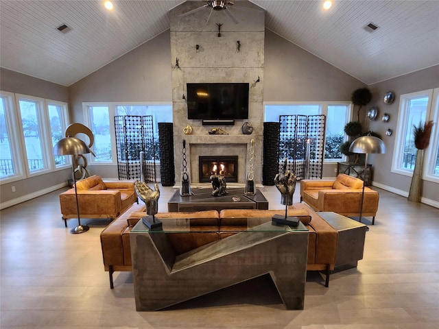 living room featuring high vaulted ceiling, wooden ceiling, hardwood / wood-style floors, and a tiled fireplace