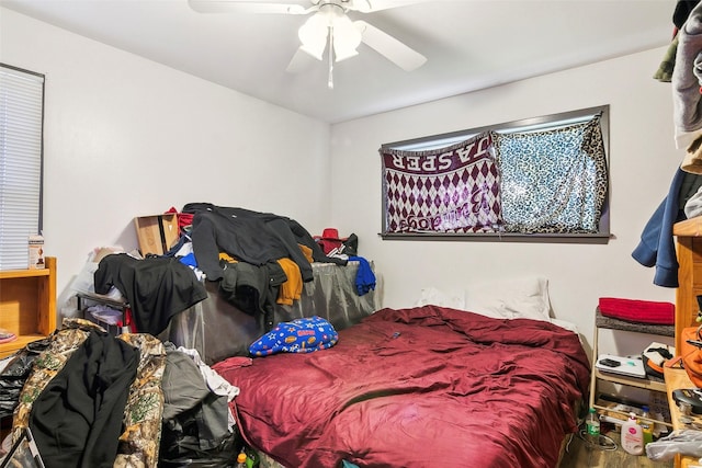 bedroom featuring hardwood / wood-style flooring and ceiling fan