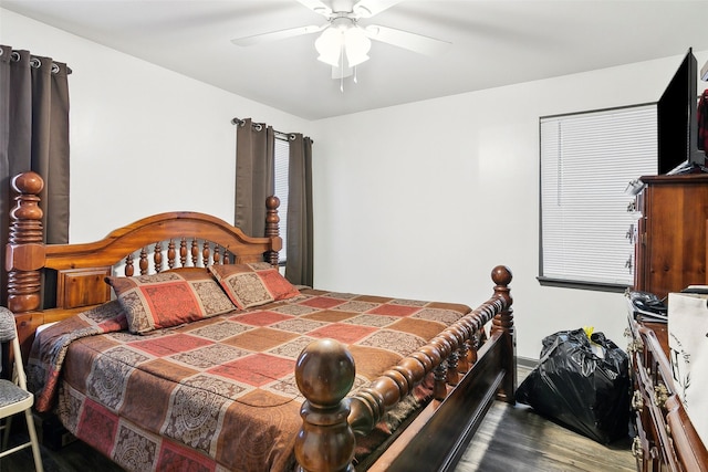 bedroom with hardwood / wood-style floors and ceiling fan